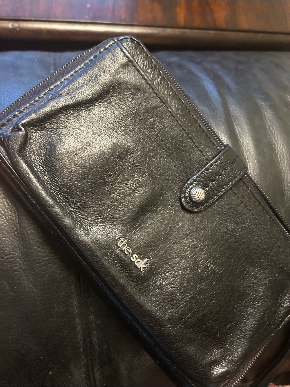 The Sak Black Leather Zip-Around Wallet with Snap Tab